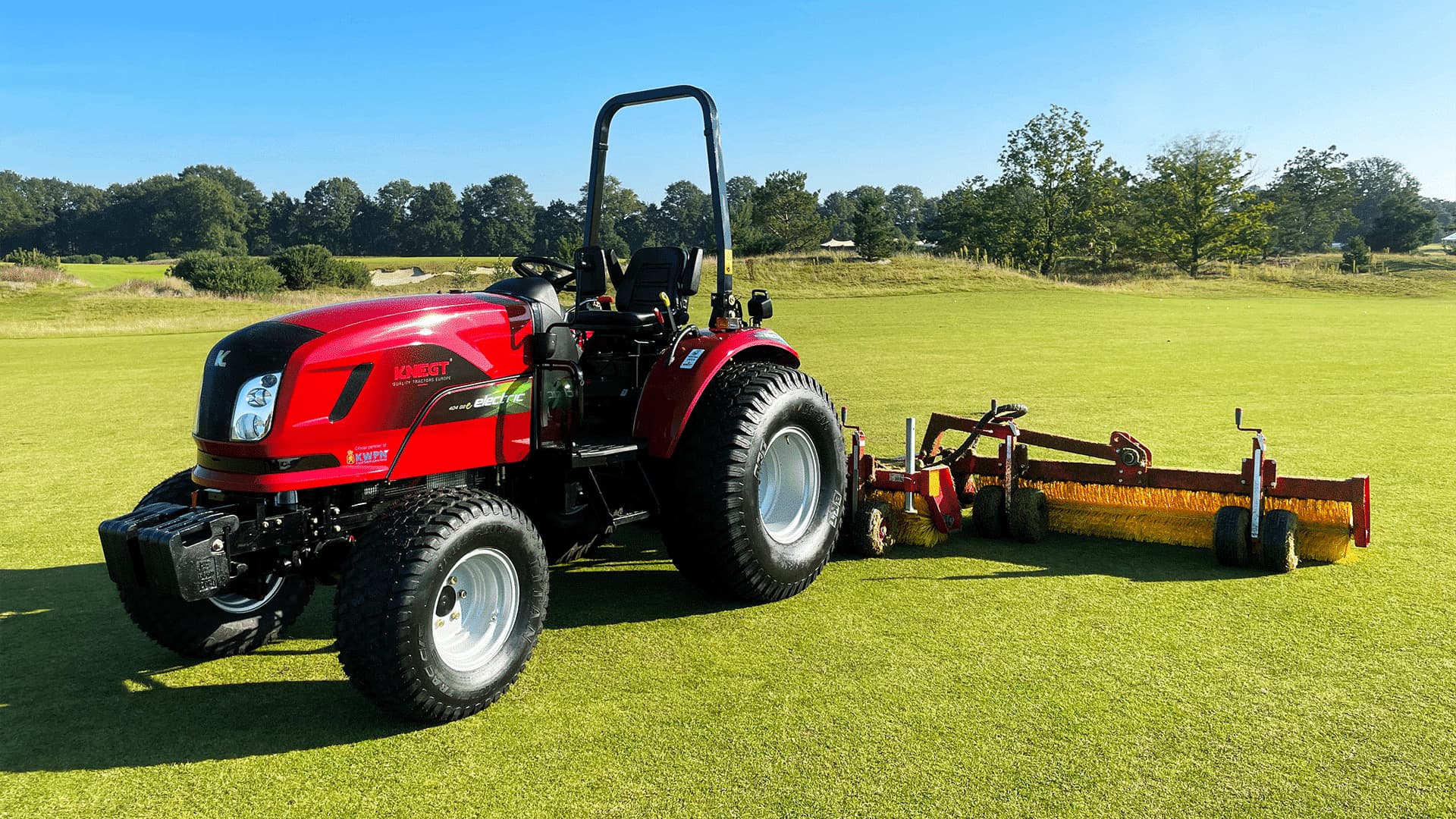 Electric tractor with sweeping machine